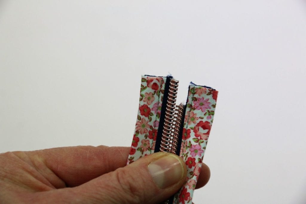 Zipper auffädeln