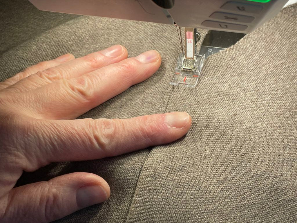 Taschenbeutel umklappen und feststeppen